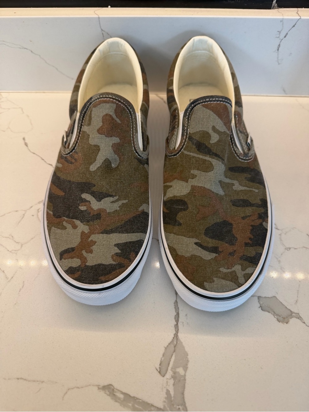 Vans Classic Slip-On sneakers in a woodland camouflage pattern